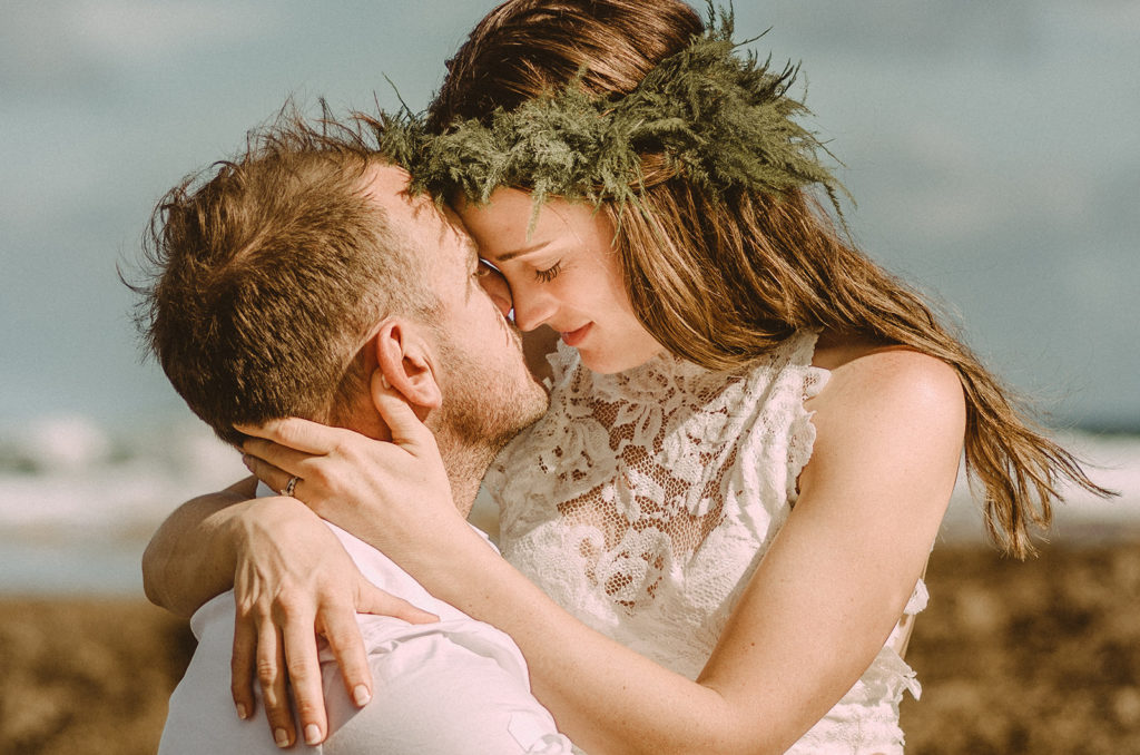 Newlyweds in front of Erata Resort beach