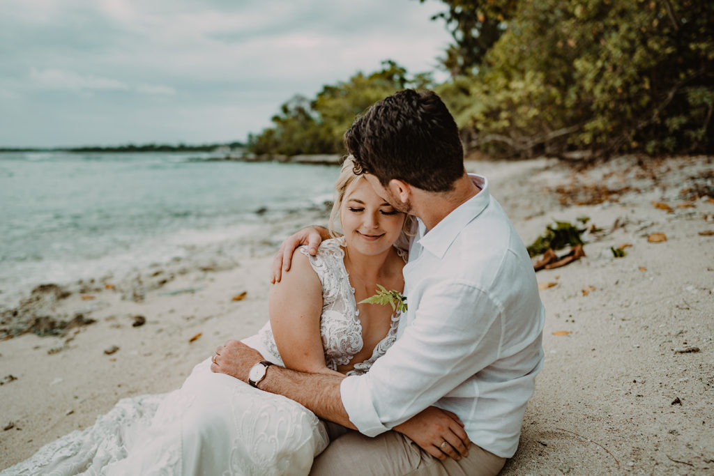 Newlyweds on the beach after their wedding ceremony on Erakor Island