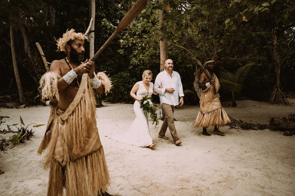 Father of the bride accompanying bride to wedding ceremony on Erakor Island